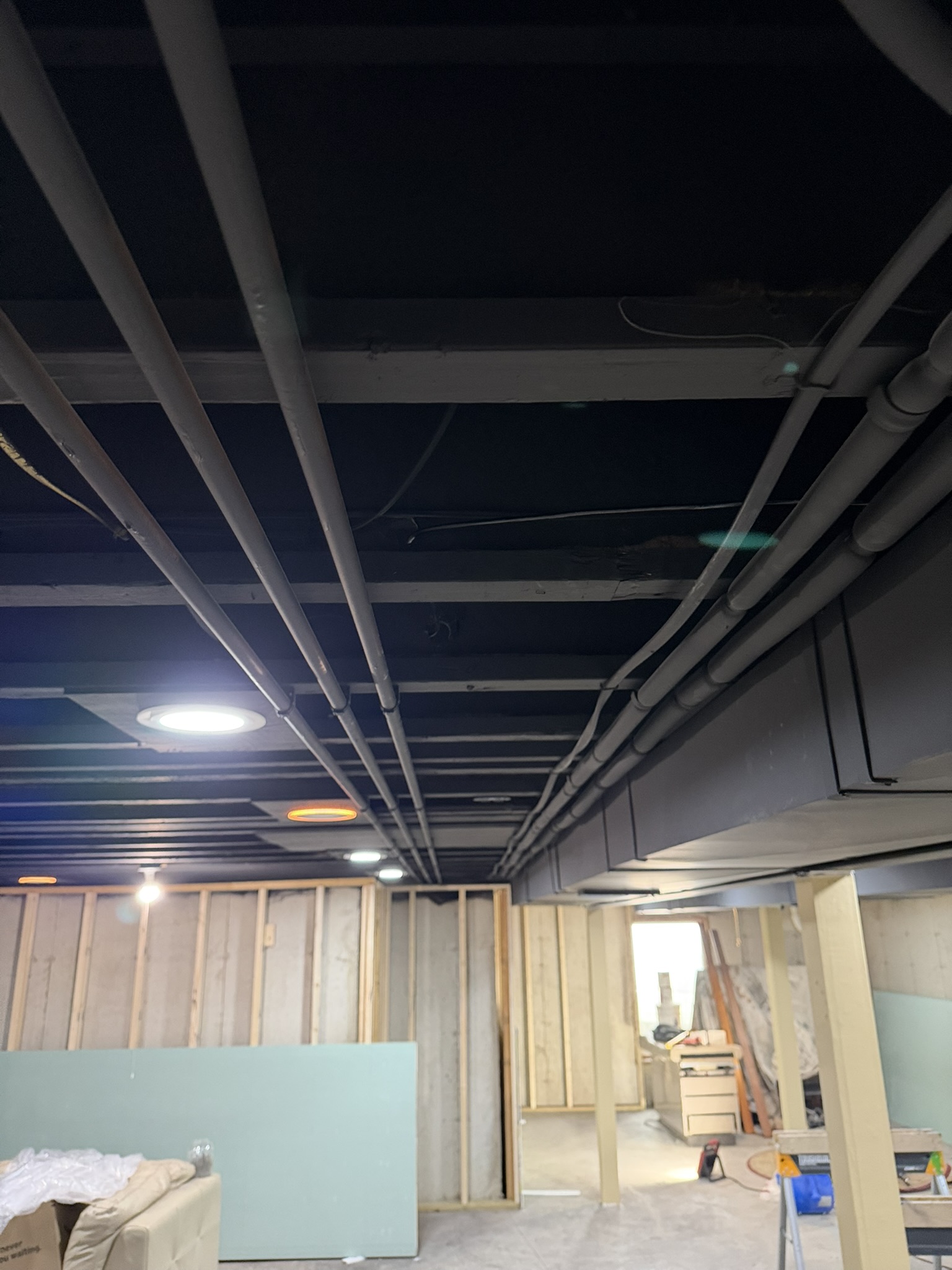 Open basement ceiling along the route for the new Ethernet drops